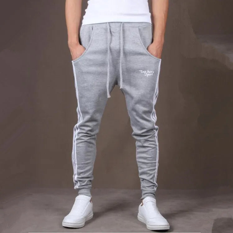 Men's straight leg cotton casual trousers with three-bar side stripe in grey, black, and navy