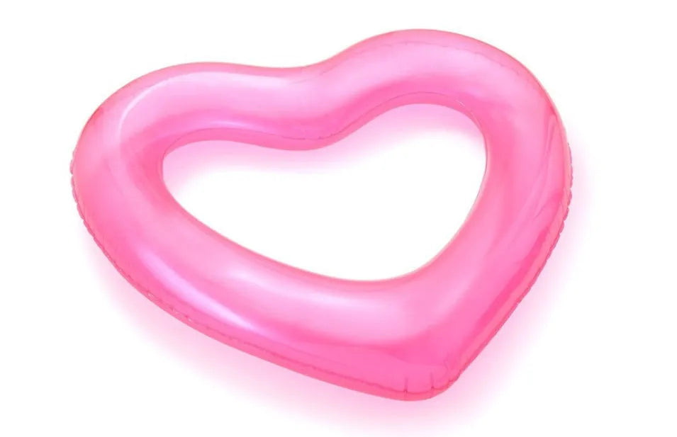 Oversized 120cm heart shaped swim ring in pink floating on water, adult outdoor pool toy