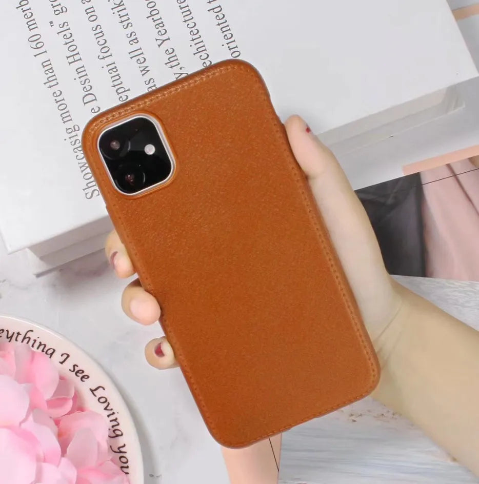 Genuine leather iPhone case with TPU bumper in Black, Brown, Navy Blue, and Wine Red colours for multiple models.