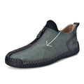 Men's black leather martin boots with a front zip, round toe, and hand-stitched seams on a rubber sole.