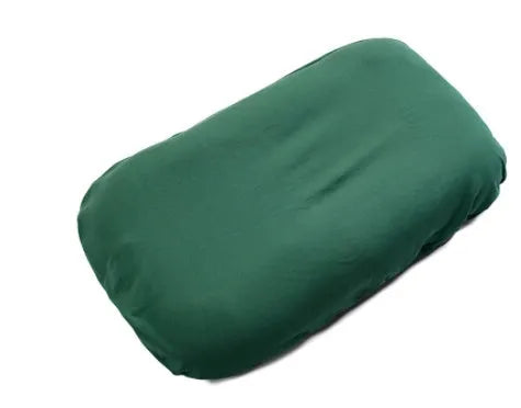 Cotton portable baby nest crib for newborns, beige colour, shown on a bed.
