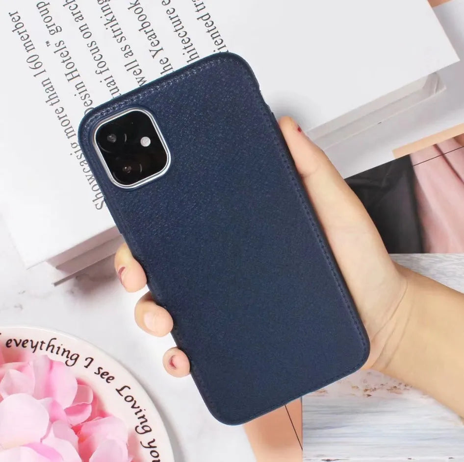 Genuine leather iPhone case with TPU bumper in Black, Brown, Navy Blue, and Wine Red colours for multiple models.