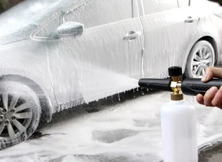 High-pressure foam gun with large detergent bottle attached to pressure washer lance