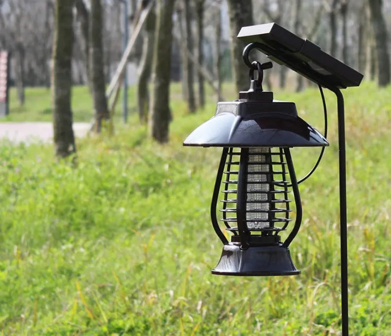 Black solar powered mosquito lamp with solar panel and LED lights for outdoor insect control