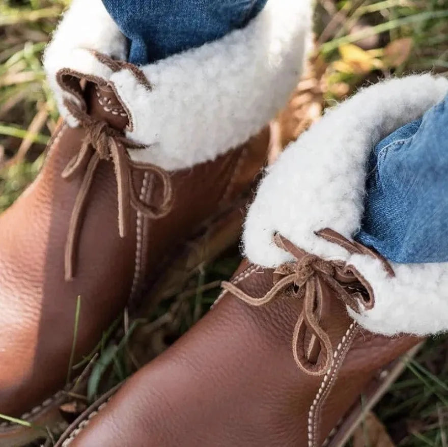 Women's winter snow boots with lace-up design, cotton lining, and non-slip rubber sole in a choice of colours