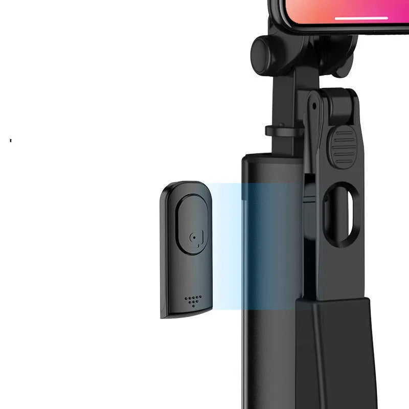 Black aluminium Bluetooth selfie stick extended with phone attached, showing remote control and tripod legs.