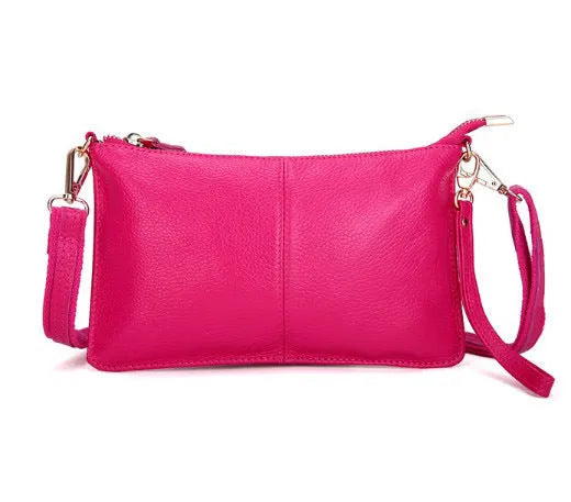 Lady's cowhide leather slant bag in apricot colour with hand strap and shoulder strap showing zipper compartments