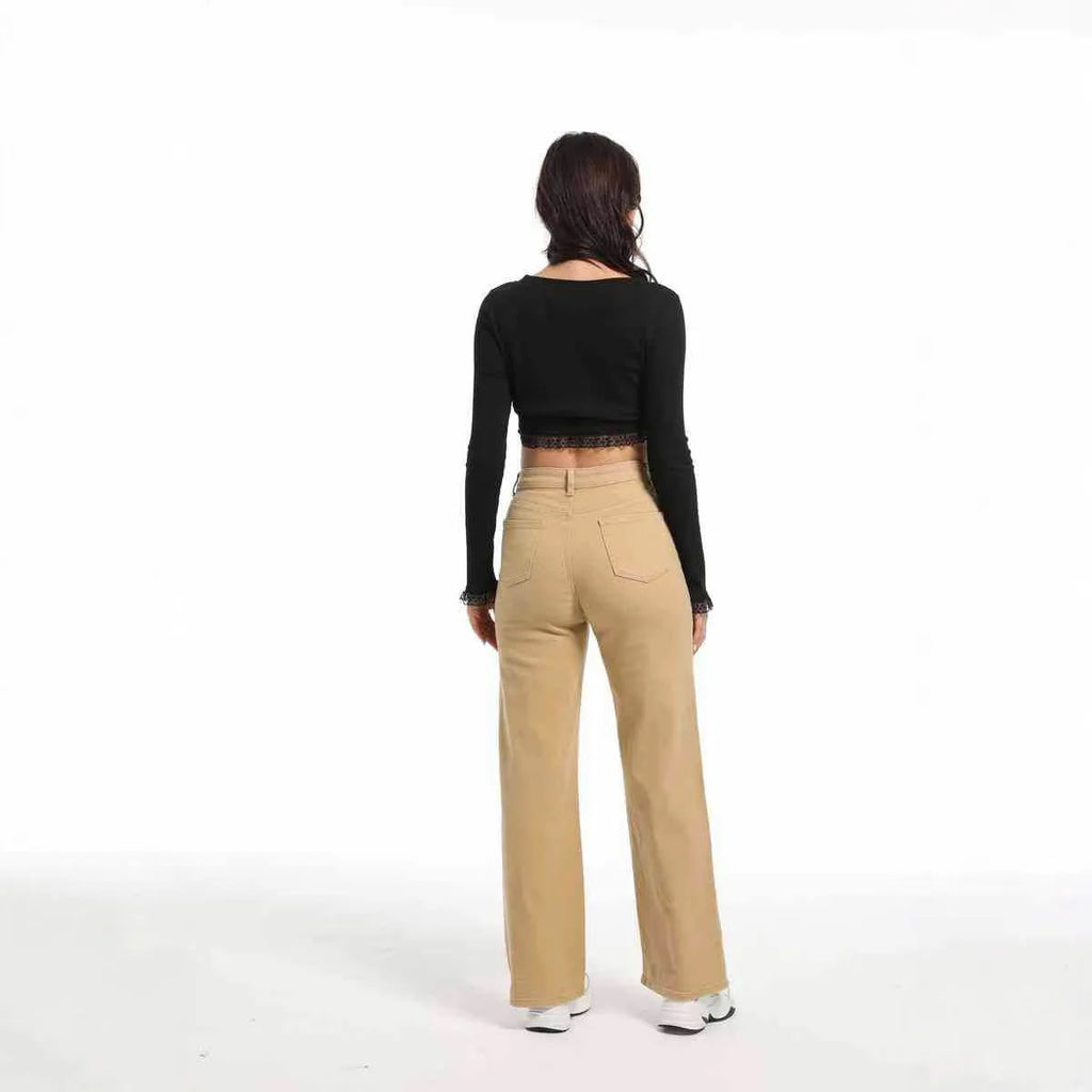 Women's high-waist straight leg cotton trousers in apricot colour, showing wide-leg silhouette.