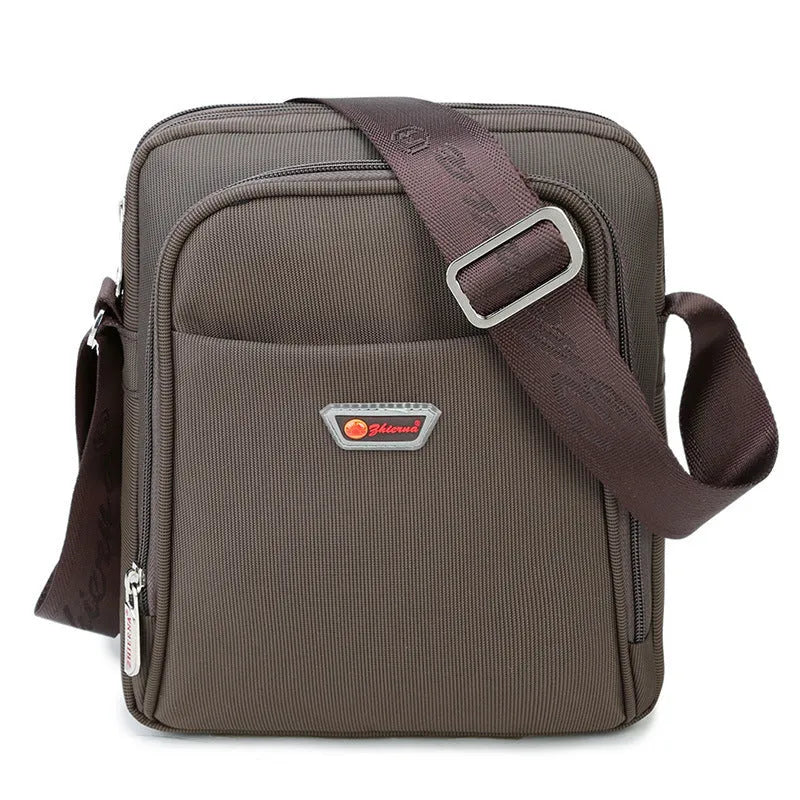 Men's black Oxford cloth messenger bag with zipper closure, single shoulder strap, and printed car-suture outer pocket