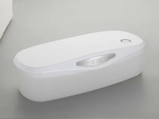 Compact white DORR UV disinfection box with USB cable for sanitising phones and small items.