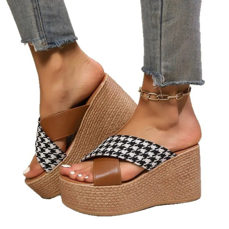Casual brown and black plaid wedge sandals with cross-leopard pattern and rubber sole.