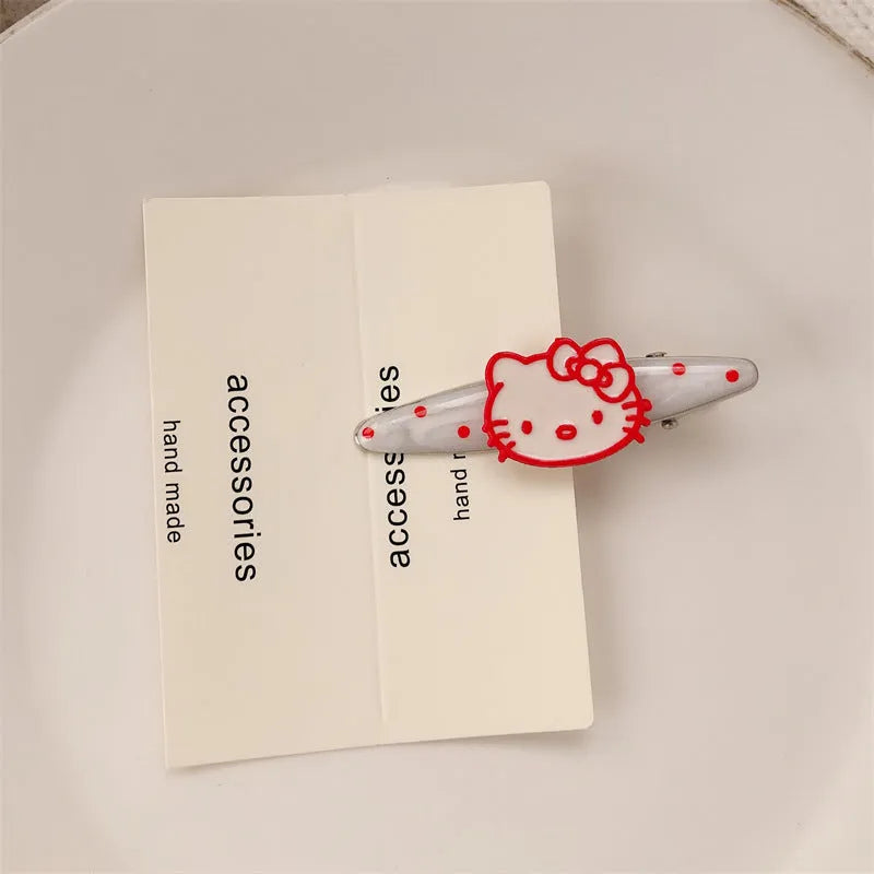 Red love heart-shaped plastic hair clip with retro dots and a willow leaf silhouette on a white background.