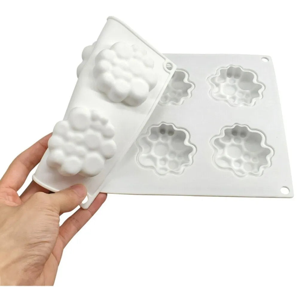 Round silicone cake mould with 8 raised bubble towers for tiered desserts.