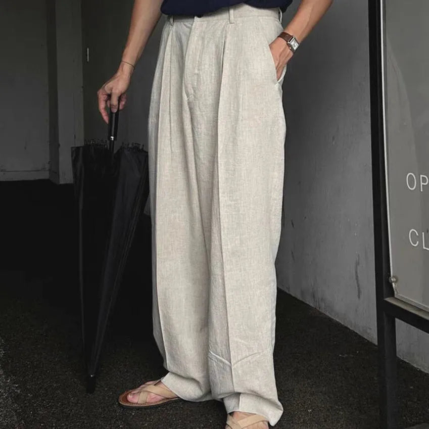 Men's light-weight apricot wide-leg cotton linen trousers with a non-iron finish on a hanger.
