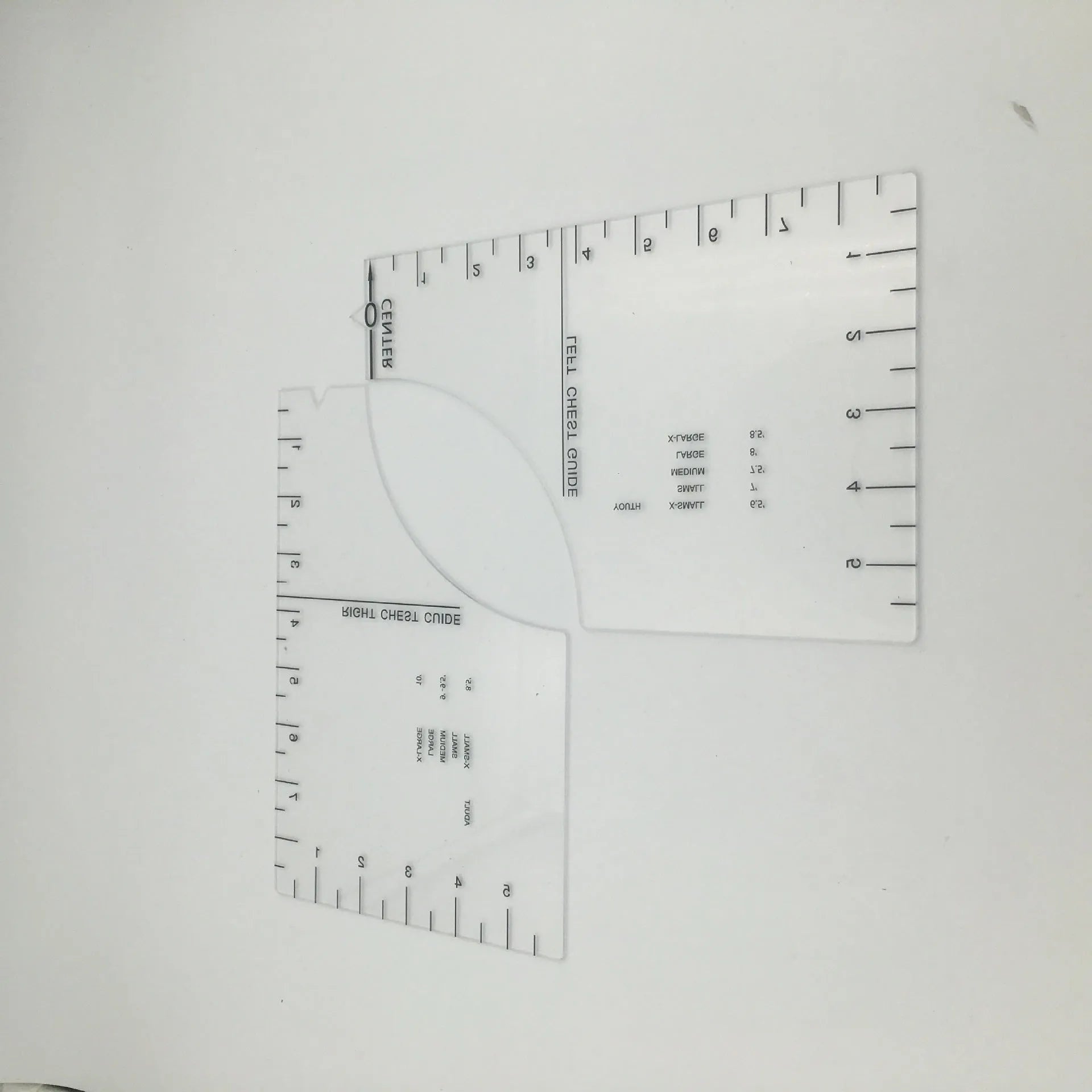 Transparent acrylic sewing patch ruler measuring 10x6 inches for T-shirt alignment and garment construction