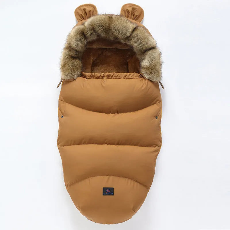 Convertible baby sleeping bag cocoon in a pram, showing cotton blend fabric and flannel lining.