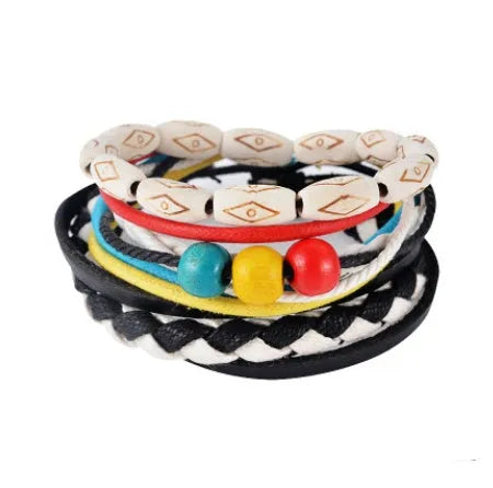 Handmade adjustable leather wrap bracelet with wooden beads on a wrist.