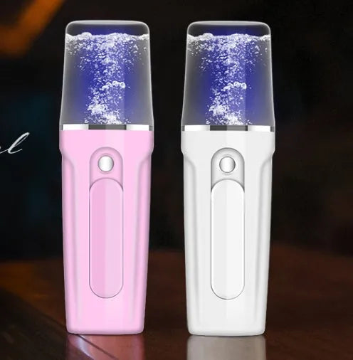 Pink handy nano mist sprayer with 26ml water tank and 2200mAh power bank on white background