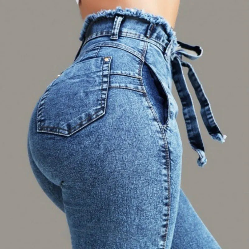 Women's fringed jeans in cowboy denim with frayed hem detail in dark blue, grey, and light blue colours