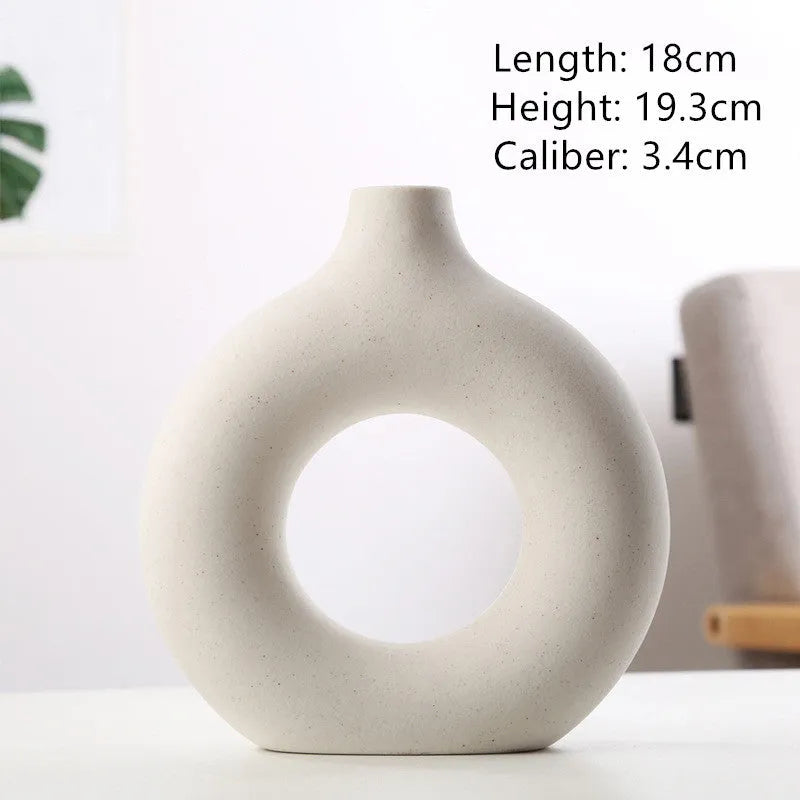 Unglazed porcelain biscuit vase with frosted particle surface in neutral colour