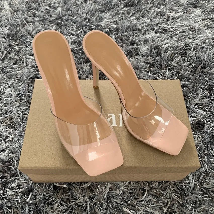Women's black and silver high heel boots with a PVC sole, shown in multiple adult sizes.