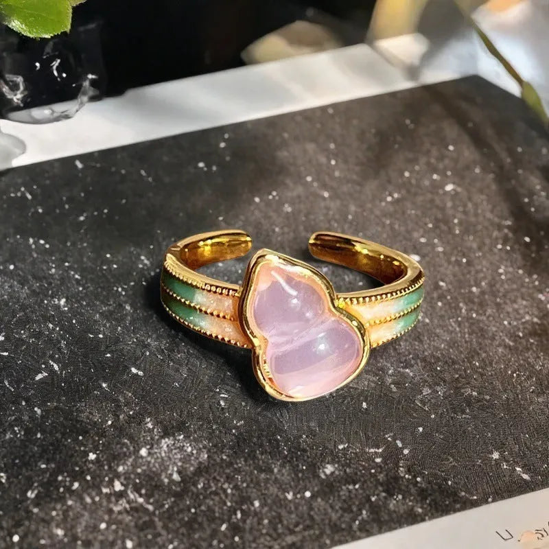 Adjustable copper ring with vintage gourd, flower, and bow design, inlaid with zircon stones.