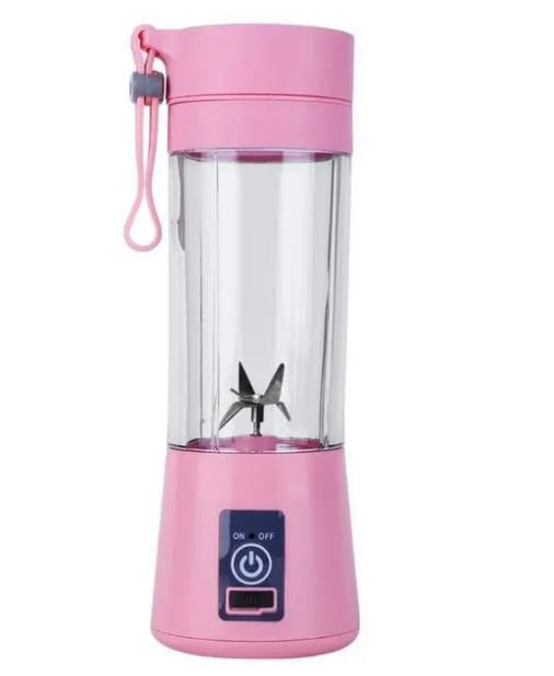 Pink mini USB electric fruit juicer with carrying rope on a kitchen countertop.