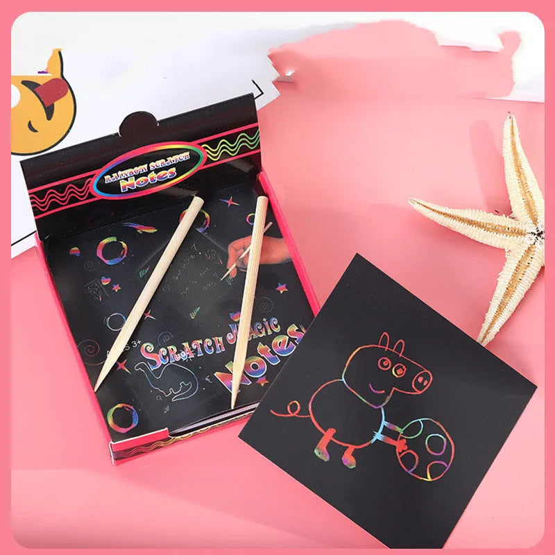 Colourful trumpet scratch art kit for children showing the design on the paper and the full presentation box.