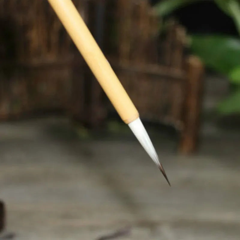 Set of four gold-coloured calligraphy brushes with wolf wool thread and mixed hair tips.