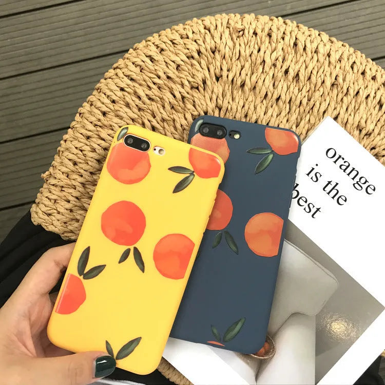 Orange matte finish TPU silicone case for iPhone on a table.