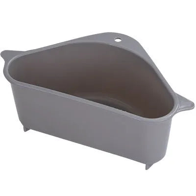 Beige plastic triangle sponge drain rack hanging from a kitchen faucet.