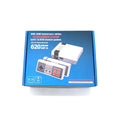 Retro 8-bit NES mini game console with two wired controllers on a table
