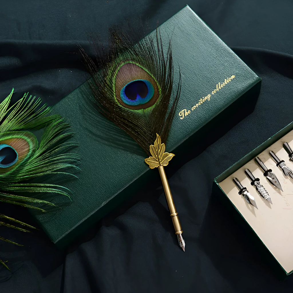 Retro green peacock feather pen set with ink bottle, base, and replacement nibs in box