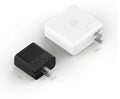 Black ZMI USB-C 65W compact laptop power adapter showing size comparison