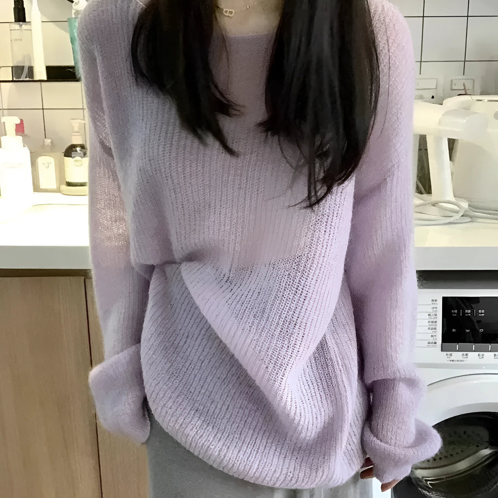 Purple women's blouse with hollow out design and princess sleeves on a hanger.