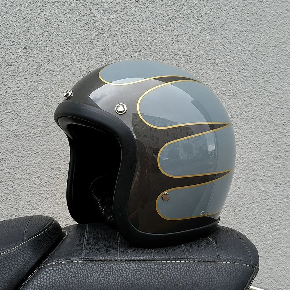 A retro-style grey half helmet for motorcycle riding, shown on a stand.