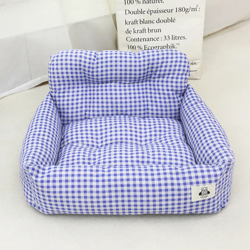 Grey and blue plaid cloth dog carrier baskets designed for mounting in a car, shown in small and large sizes.
