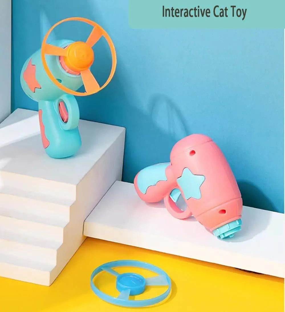 Blue interactive cat toy gun with plastic Frisbee on launch mechanism for indoor hunting play
