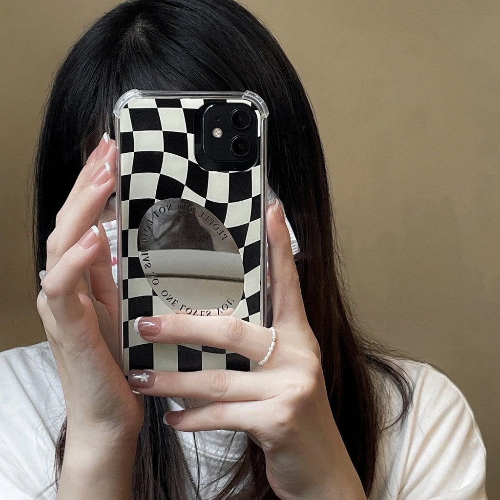 Mirror phone case with chessboard plaid pattern against black background