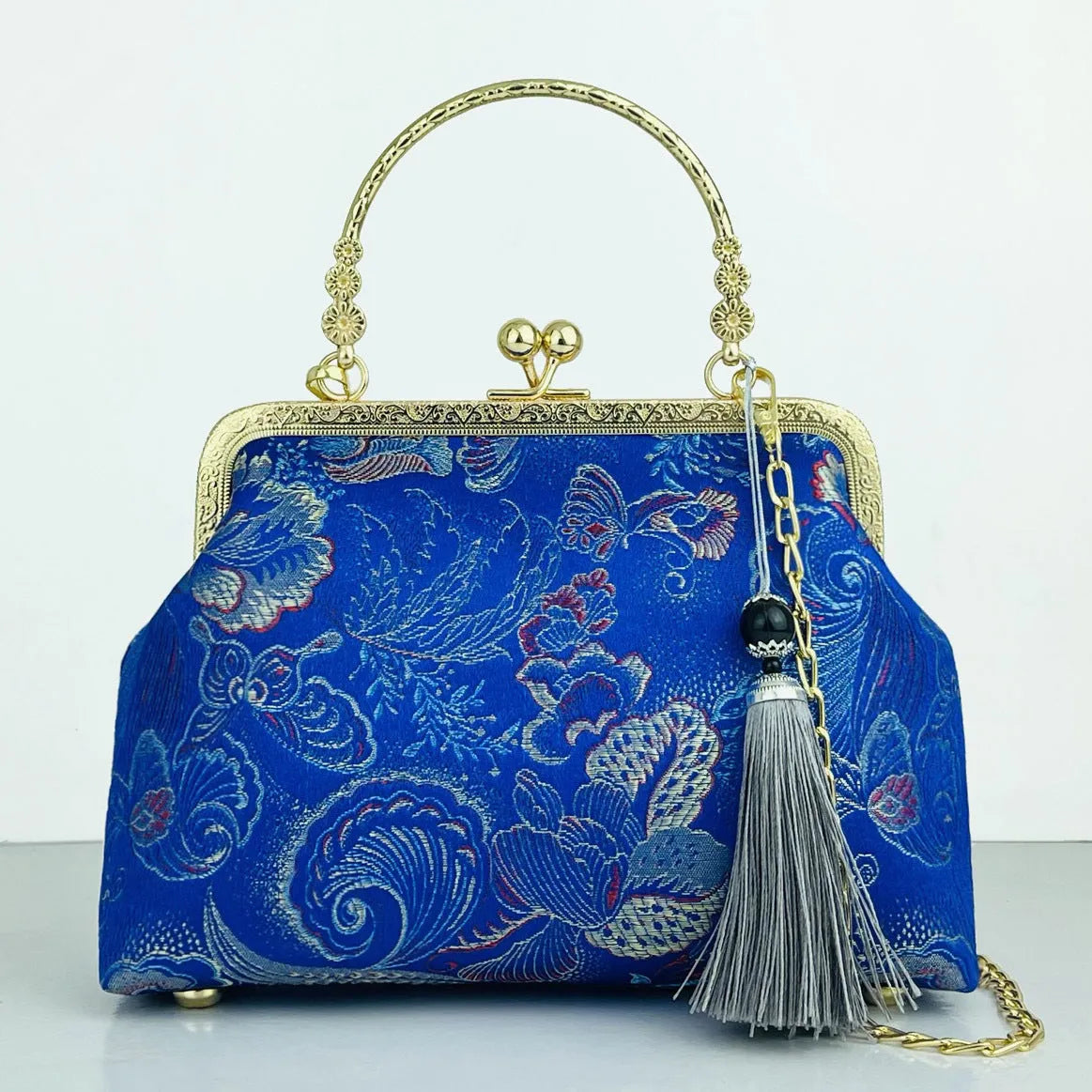 Chinese embroidery cheongsam handbag in polyester with shell shape and internal zipper compartment