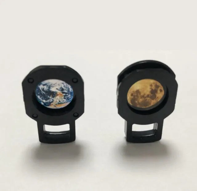 White ABS star projector with flexible hose, showing earth and moon projection chips and USB cable.