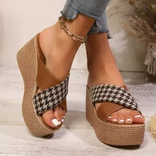 Casual brown and black plaid wedge sandals with cross-leopard pattern and rubber sole.