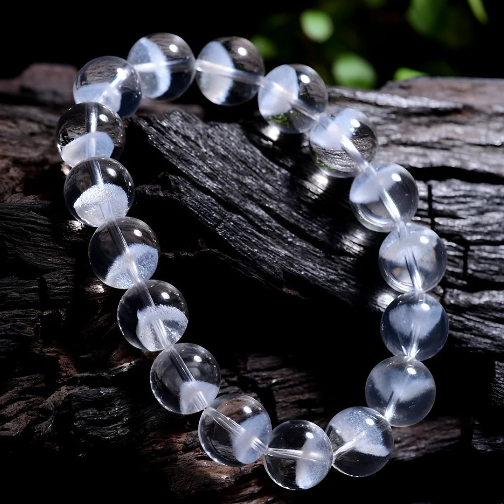 Women's white crystal ghost pyramid bracelet with Ruyi charm on a wrist, showing adjustable sizing.
