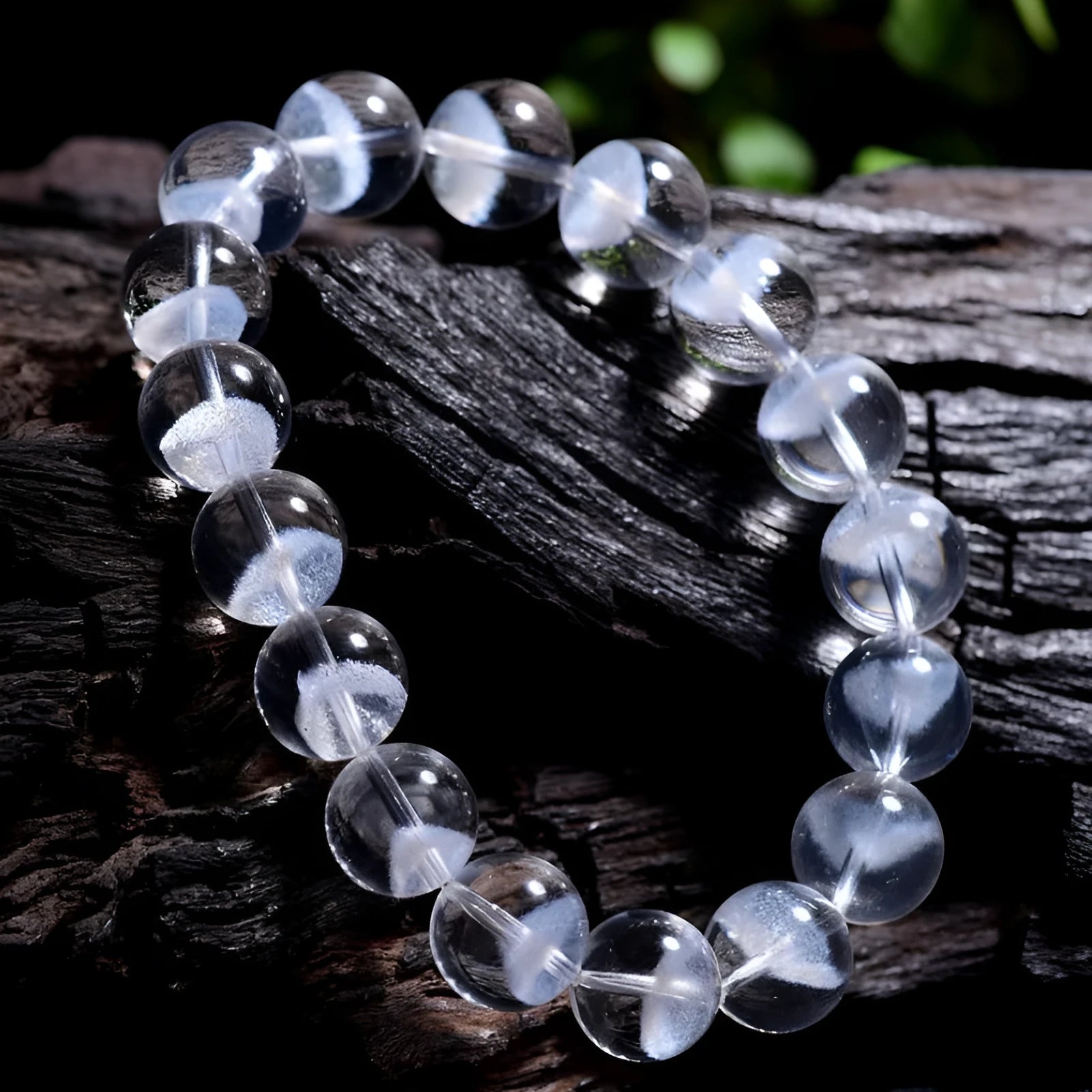 Women's white crystal ghost pyramid bracelet with Ruyi charm on a wrist, showing adjustable sizing.