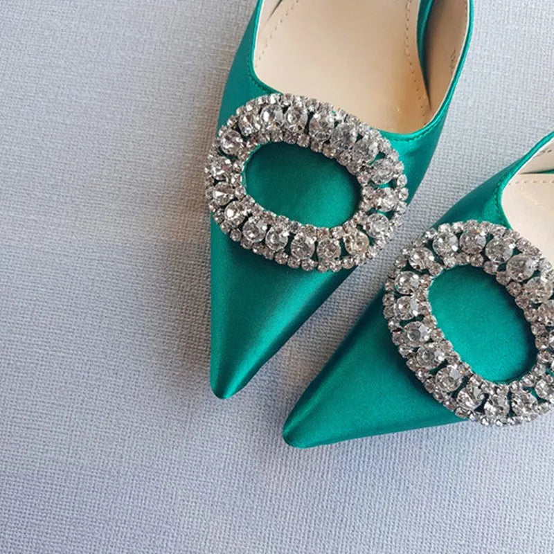 Red satin rhinestone high heel pump with pointed toe and buckle strap on stiletto heel
