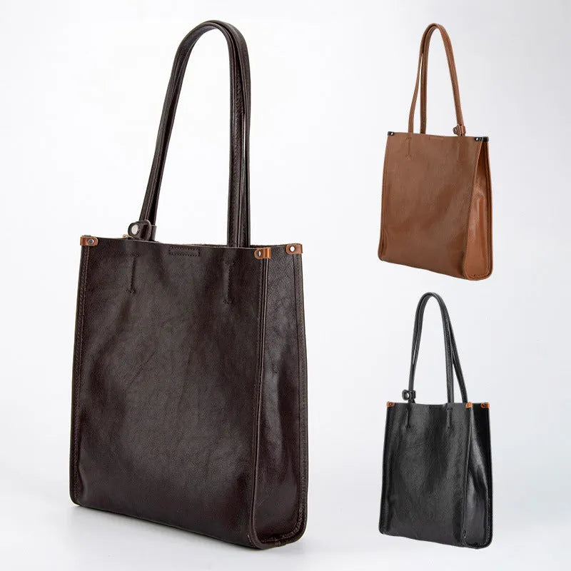 Large capacity genuine leather city commuter shoulder tote bag in black, soft square vertical shape with slit pocket