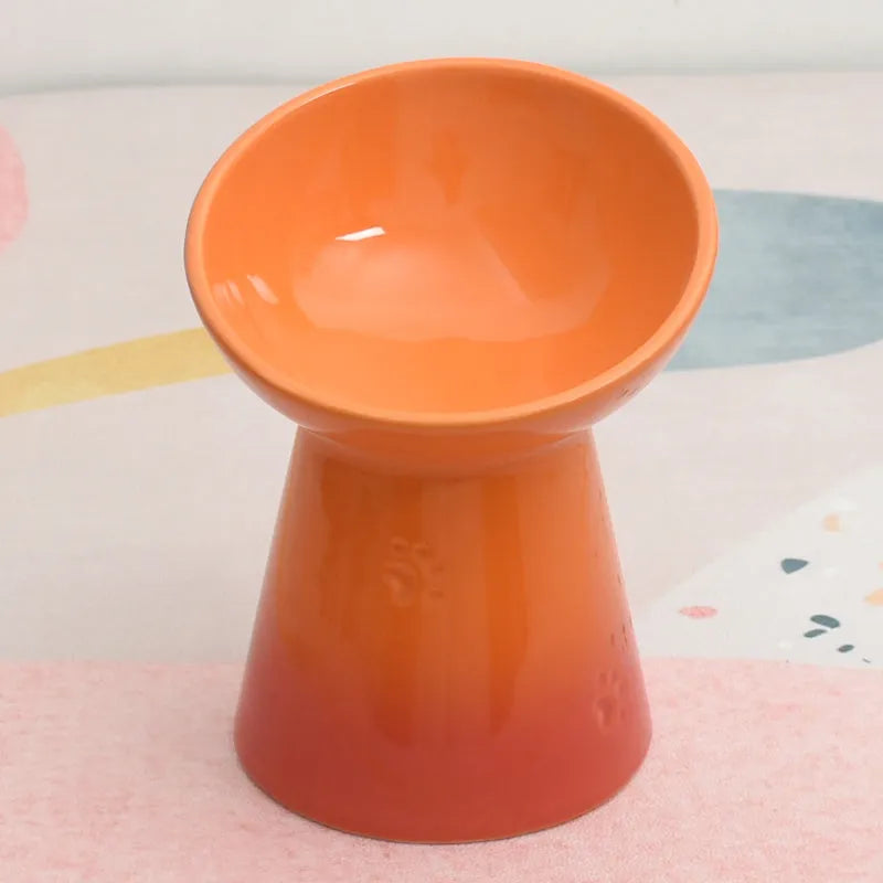 Black ceramic pet bowl with a high foot and neck protector to prevent tipping, shown with flat and slanted rim options.