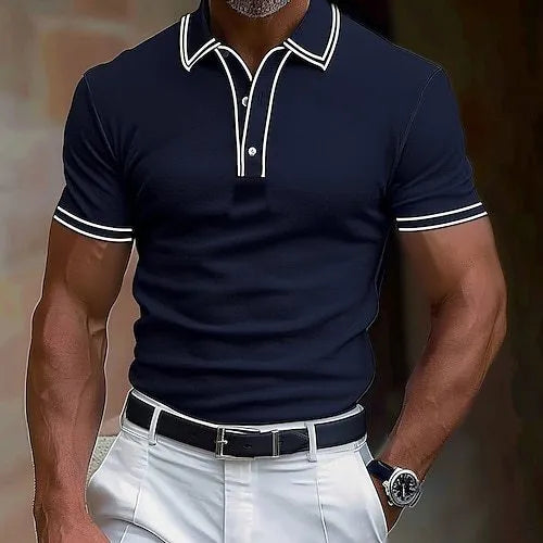 A man wearing a loose-fitting, striped short-sleeved T-shirt for casual summer leisure.