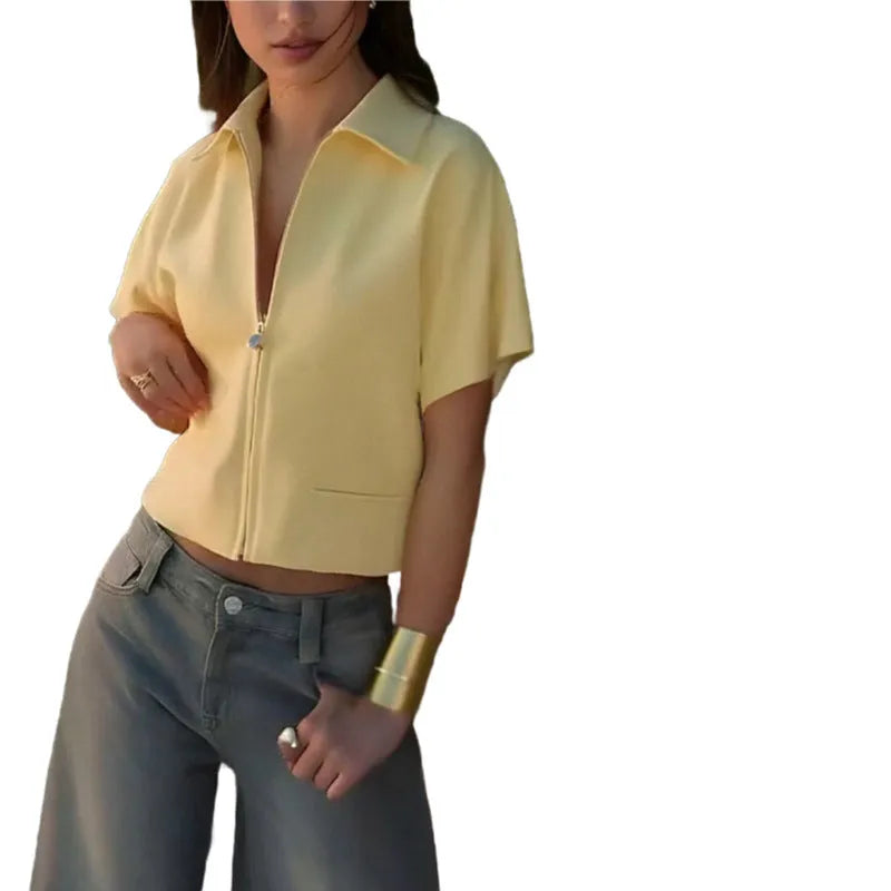 A man's loose-fitting black casual short-sleeve shirt made from polyester fabric.