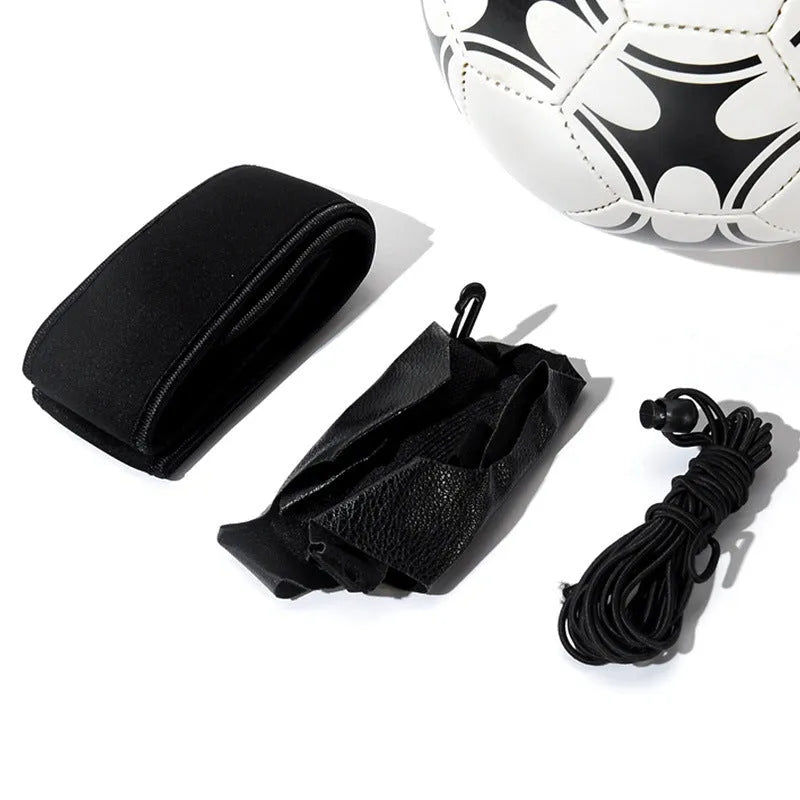 Black soccer training tether with adjustable waist belt and elastic Velcro strap on a green grass field